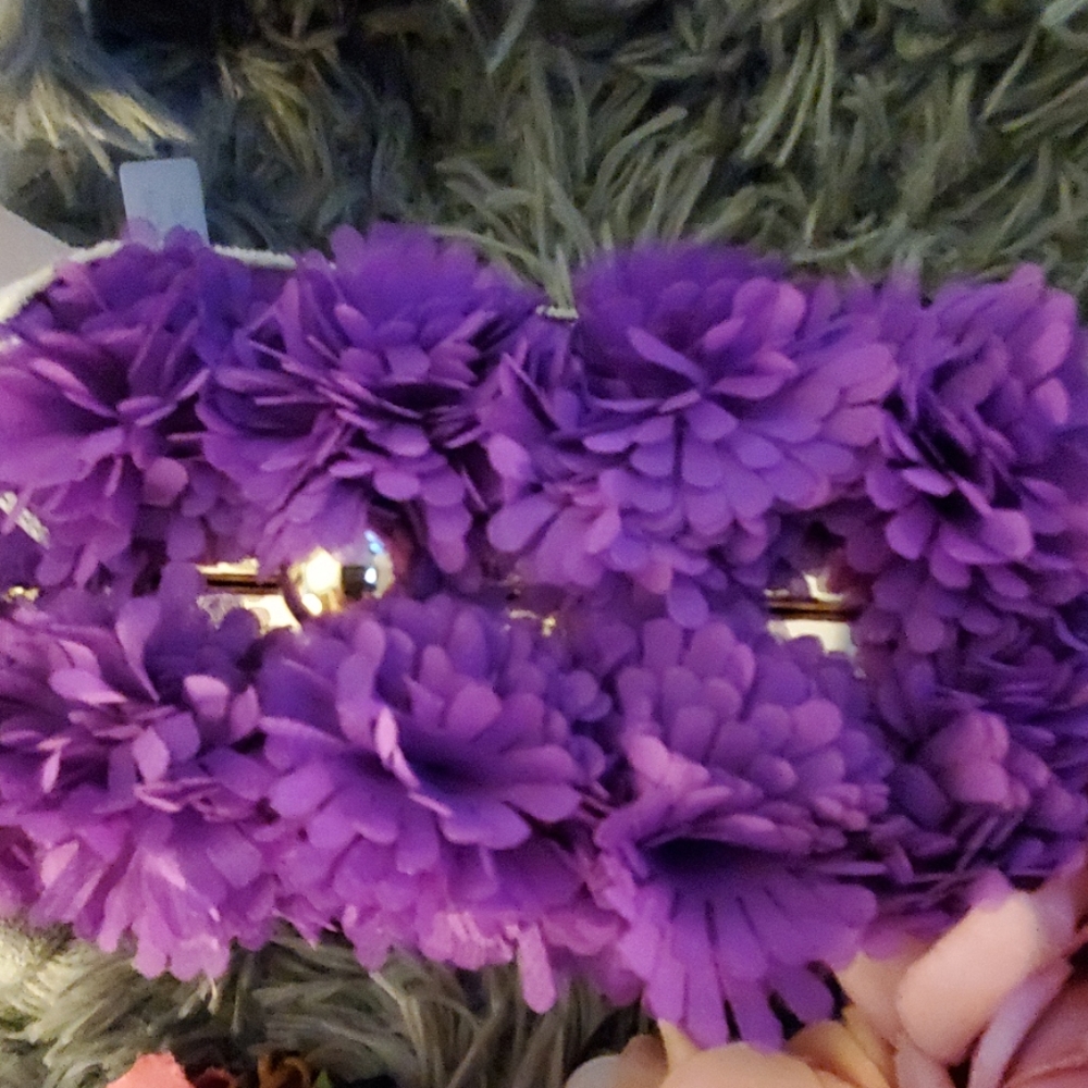 Amongst the flowers purple purse so pretty ,clean
